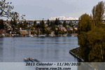 March - eight racing through Montlake Cut with Olympic mountains in background - Click for full-size image!