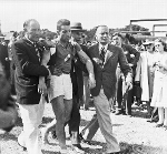 July, 6 1946.  French rower Jean Sepheriades (1922 - 2001) is helped from the jetty after beating American rower John B Kelly, Jr in the final of the Diamond Sculls at HRR. Courtesy of HRR - Click for full-size image!