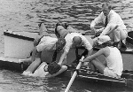 1977 Officials drag St Catherine's College Cambridge stroke from the Thames after he collapsed from exhaustion and fell overboard during a heat in the Visitor's Challenge Cup. Courtesy of HRR - Click for full-size image!