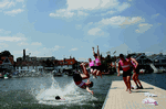 July 7, 2013. Members of Griffen Boat Club jump into the river in celebration after winning the final of the Thames Challenge Cup on finals day of the Henley Royal Regatta. Courtesy of HRR - Click for full-size image!