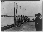 1913 Washington Varsity 8 rowing team posed on dock holding oars. Courtesy of the Library of Congress. - Click for full-size image!
