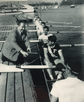 Fordham V8 launching at the NYAC boathouse (late 1950s) with coach John J. Sulger, an alumnus who was a former Olympic Committee official and past president of the NAAO. Courtesy of James Sciales - Click for full-size image!
