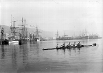 Four rowers and their cox out on Wellington Harbour. Courtesy of the National Library of New Zealand. - Click for full-size image!