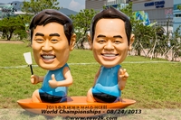 I think these are two famous Korean comedians.  Their bobblehead likeness is everywhere at the venue and the creepiness cannot be overstated - Click for full-size image!
