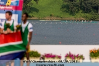 The GER M8+ lurking on the course during the adaptive medal ceremony - Click for full-size image!